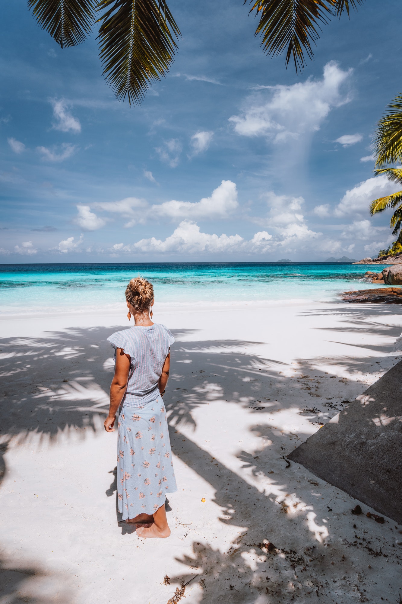 travel-female-tourist-enjoy-exotic-tropical-beach-with-blue-ocean-pristine-lagoon-recreation-summer.jpg